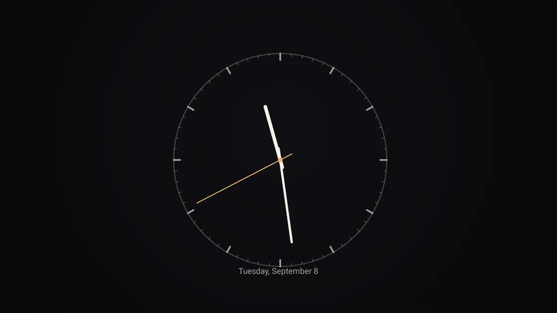 PhotoWall analogue clock scene showing a minimal clock face on a television
